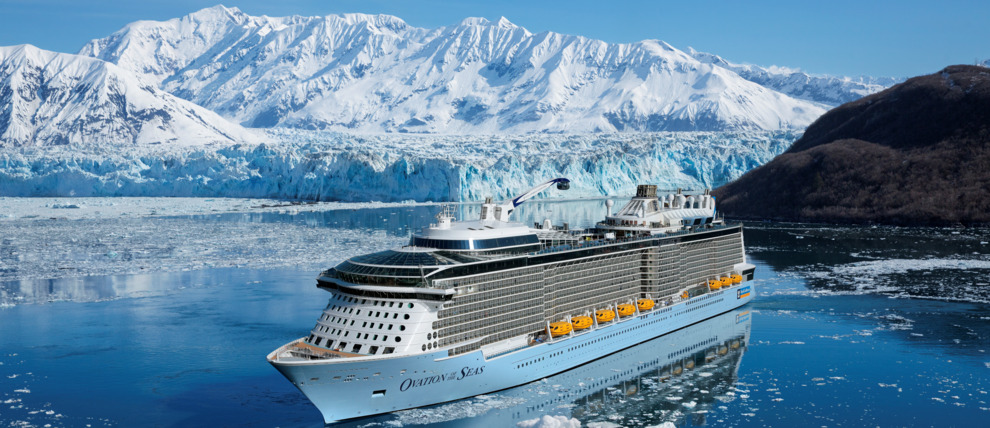 Royal Caribbean Cruises Ovation of the Seas cruising in front of a glacier in Alaska.