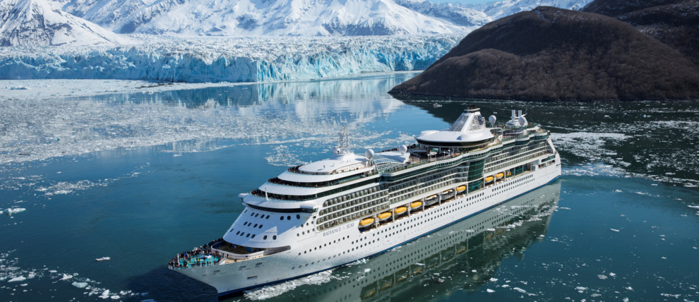 Royal Caribbean Cruises Radiance of the Seas cruising in front of a glacier in Alaska.