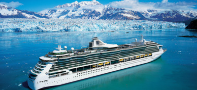 Royal Caribbean Cruises Serenade of the Seas cruising in front of a glacier in Alaska.