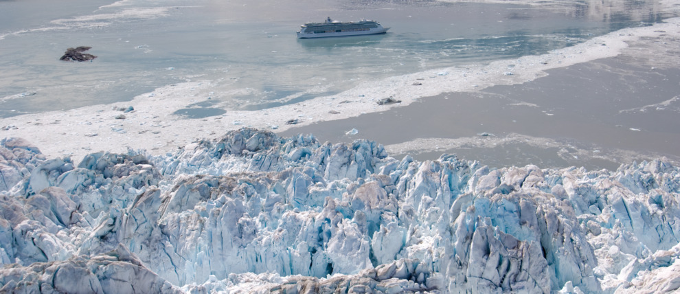 Royal Caribbean Cruises Serenade of the Seas cruising in front of a glacier in Alaska.