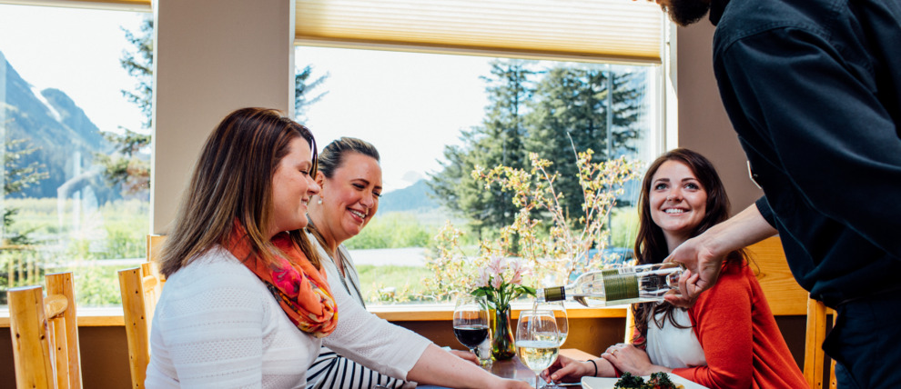 Enjoy a meal at the restaurant at Seward Windsong Lodge.
