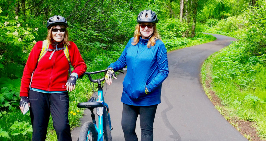 Visitors stop for a picture in Kincaid Park.