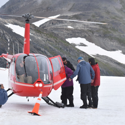 Guests boarding the helicopter bound for Punch Bowl Glacier.