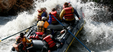 Group paddles through whitewater rapids on the Nenana River.