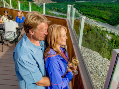 Couple enjoying the view from the Grande Denali Lodge. 