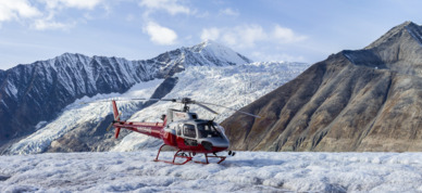 Helicopter landing on Yanert Glacier in the Alaska Range.