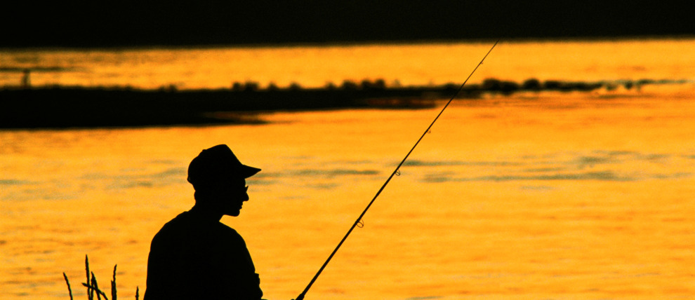 Fisherman silhouette at Resurrection Creek in Southcentral Alaska.