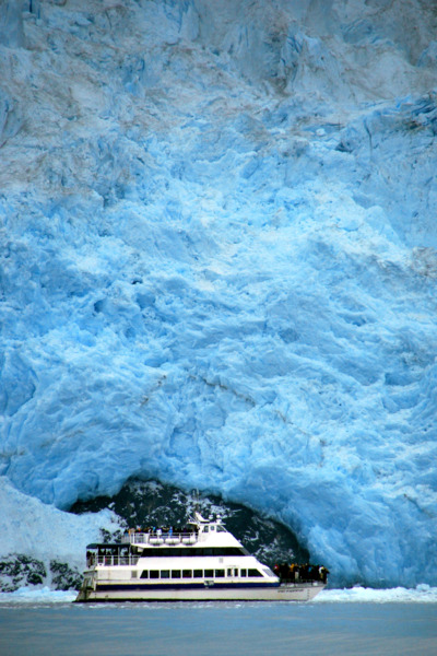 Boat underneath the Aialik Glacier in the Kenai Fjords National Park.