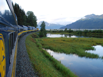 Alaska Railroad train turns around the bend on its way to Seward.
