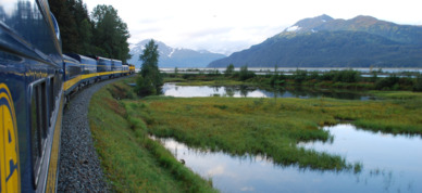 Alaska Railroad train turns around the bend on its way to Seward.