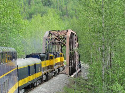 Alaska Railroad train passes over a bridge on its way to Denali National Park.
