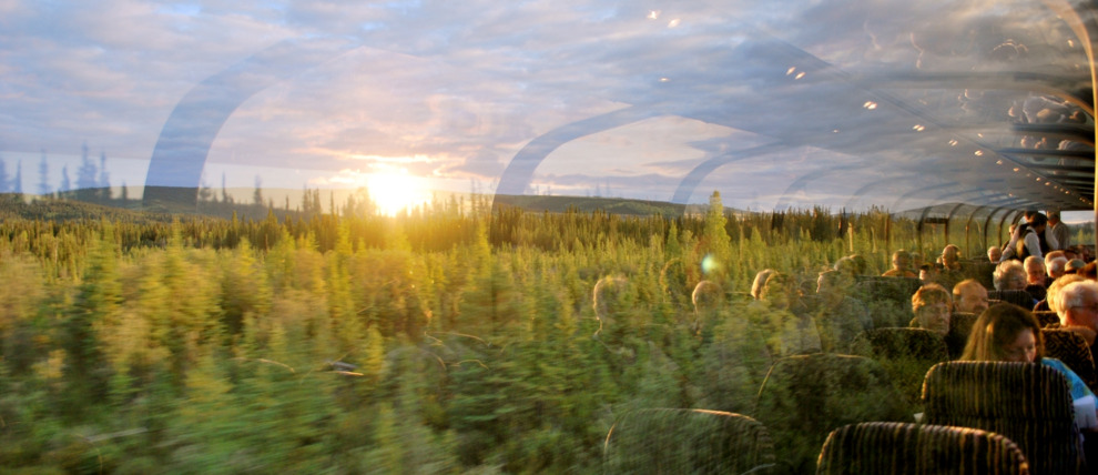 Railroad dome car passengers enjoying the sunset on their way to Fairbanks. Railroad dome car passengers enjoying the sunset on their way to Fairbanks.