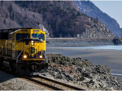Alaska Railroad locomotives pull freight along the Turnagain Arm towards Anchorage. 