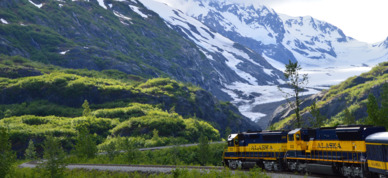 Alaska Railroad train turning around a bend on its way to Seward.