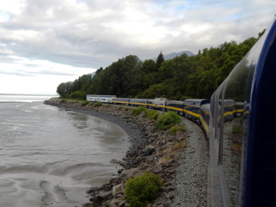 Alaska Railroad train on a cloudy day making its way to Seward.