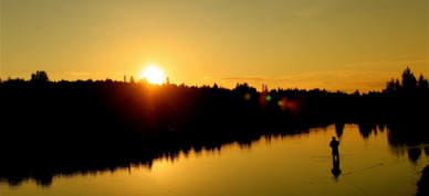 Fisherman enjoys the sunset in Anchorage Alaska.