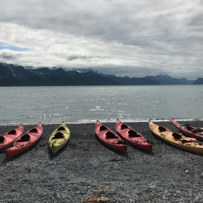 Kayaks on the shore of Resurrection Bay near Seward Alaska.  Kayaks on the shore of Resurrection Bay near Seward Alaska.