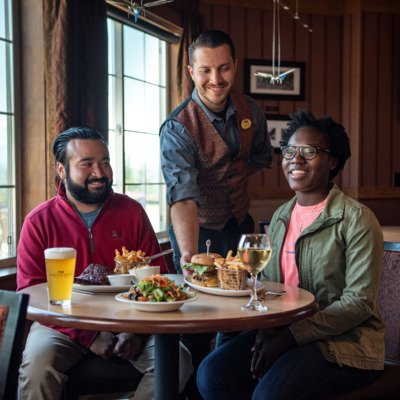 Guests enjoying dinner and view in Copper Princess lounge.