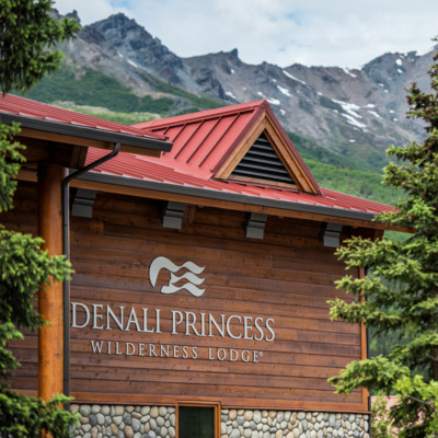 Denali Princess Lodge sits among mountain background. Denali Princess Lodge sits among mountain background.