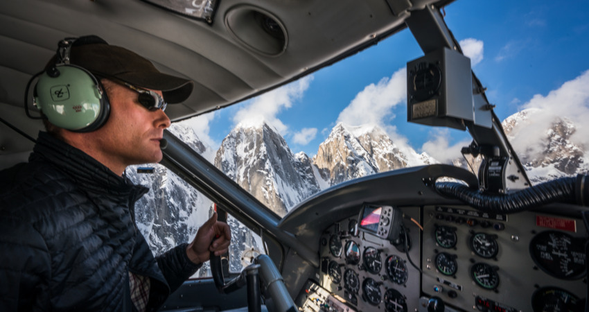 Pilot navigating the K2 Aviation Denali Experience flight.