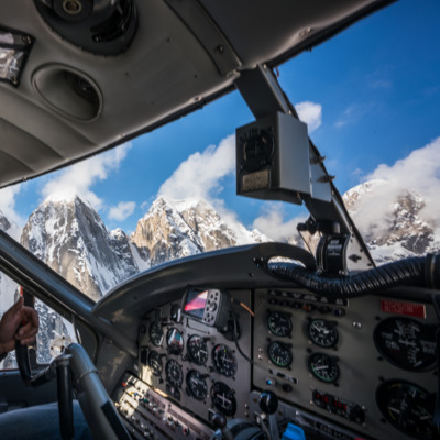Pilot navigating the K2 Aviation Denali Experience flight. Pilot navigating the K2 Aviation Denali Experience flight.