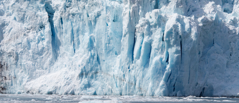 Tidewater glaciers expand throughout fjords and end in the ocean.