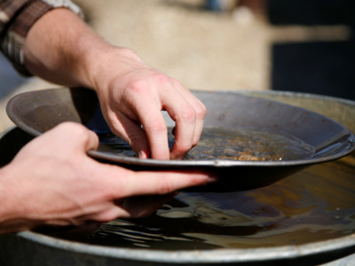 Alaskan miners are on hand to help you pan for gold.