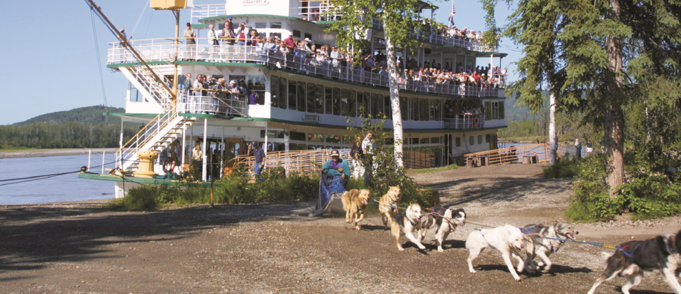 Guests can enjoy a Dog Sled demonstration from on board the Riverboat Discovery.