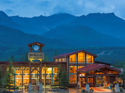 Holland American Denali Lodge located in front of a mountain range.