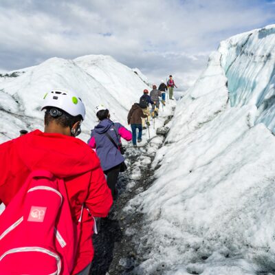 Guests practice walking on ice with an experienced guide.