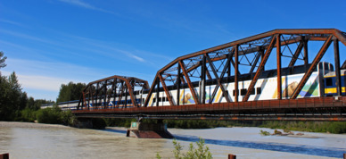 Train crossing the Knik River bridge.