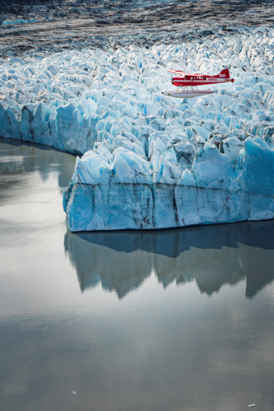 Fly over a tidewater glacier and look for glacier calving.