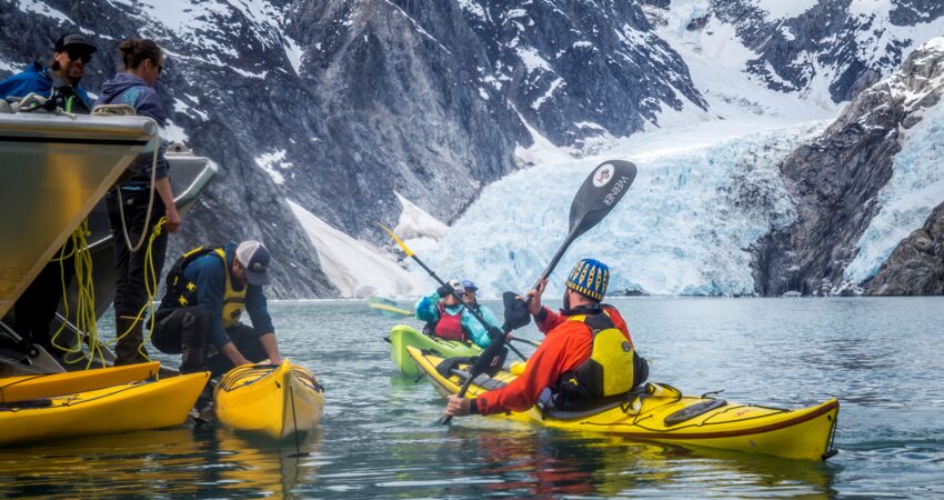 Reboarding the boat after an exploration of Northwestern Fjord.