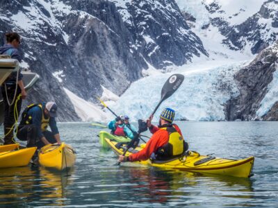 Reboarding the boat after an exploration of Northwestern Fjord.