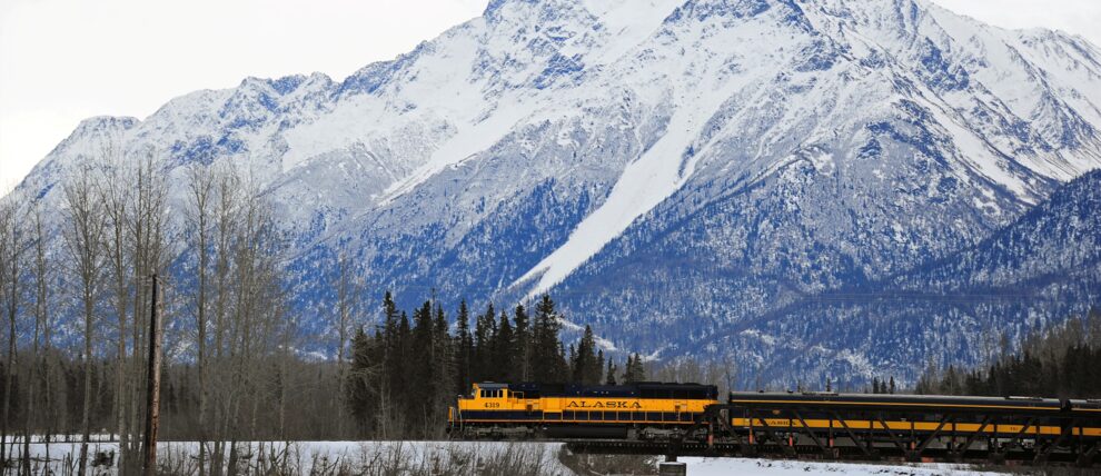 The winter train passes beneath Pioneer Peak on the way to Denali. The winter train passes beneath Pioneer Peak on the way to Denali.