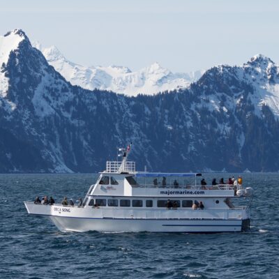 Coastal mountain make a dramatic backdrop for Seward-based Orca Song. Coastal mountain make a dramatic backdrop for Seward-based Orca Song.
