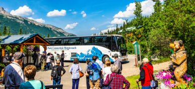 Passengers wait to board the Park Connection at the Denali Bluffs.