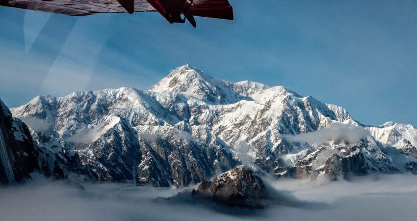 Meeting the face of Denali, from above the clouds. Photo by Tony Thompson. 