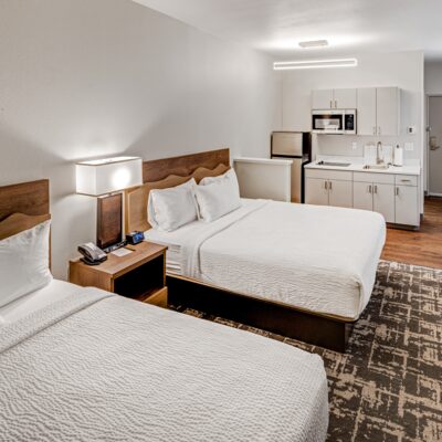 Two queen beds in a comfy kitchenette room as the Anchorage Aspen Suites.